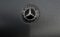 Closeup badge of world famous modern expensive luxury car on dark grey background