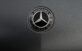 Closeup badge of world famous modern expensive luxury car on dark grey background
